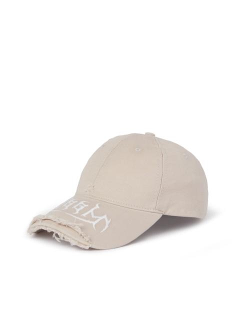 Gabardine cotton baseball cap with distressed effect and embroidered label