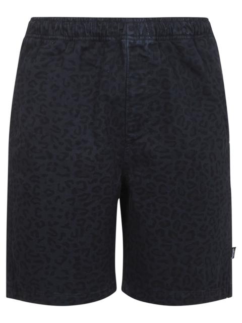 Ink blue cotton denim beach shorts with all-over leopard print.