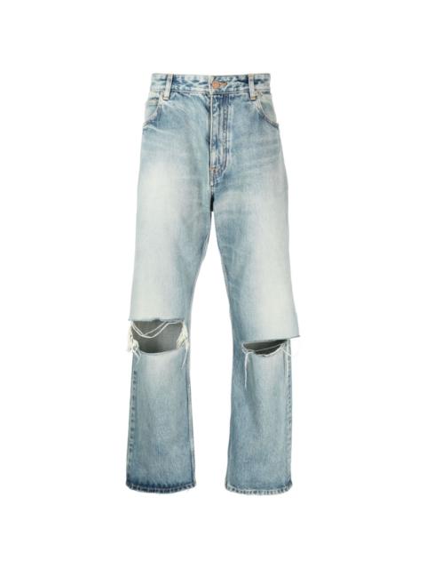 BALENCIAGA distressed low-rise wide-leg jeans