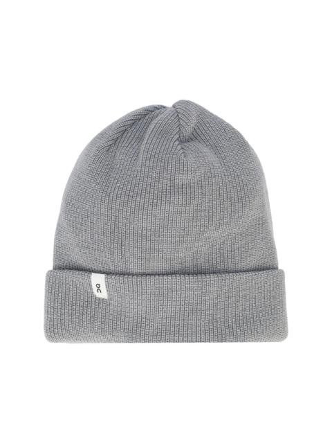 On ribbed-knit beanie hat