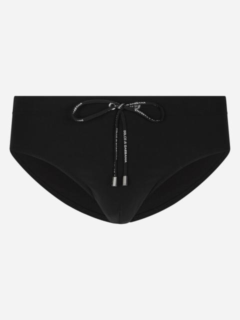 Swim briefs with high-cut leg and branded rear waistband