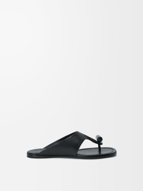 Loewe Toggle flat sandal in shiny smoot calfskin