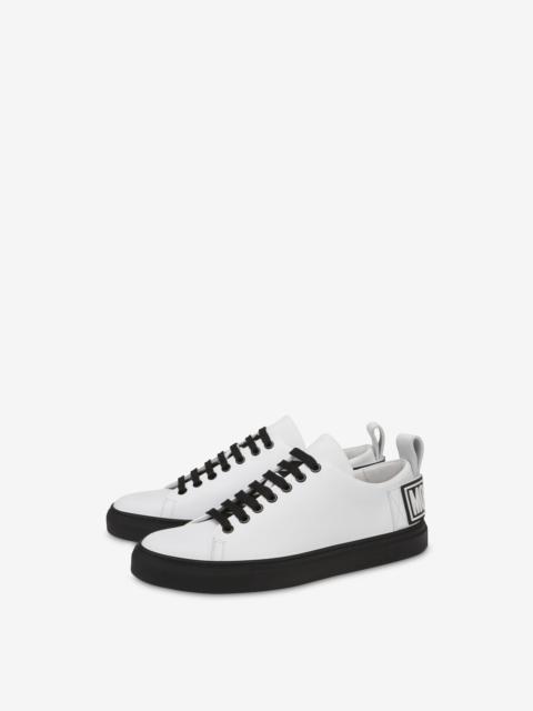 Moschino logo-embossed low-top sneakers | REVERSIBLE