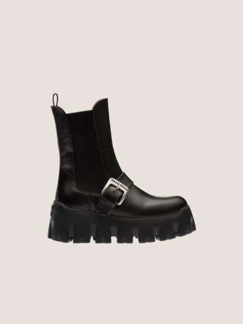 Miu Miu Leather booties with strap