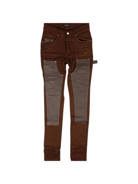 AMIRI leather-detail jeans