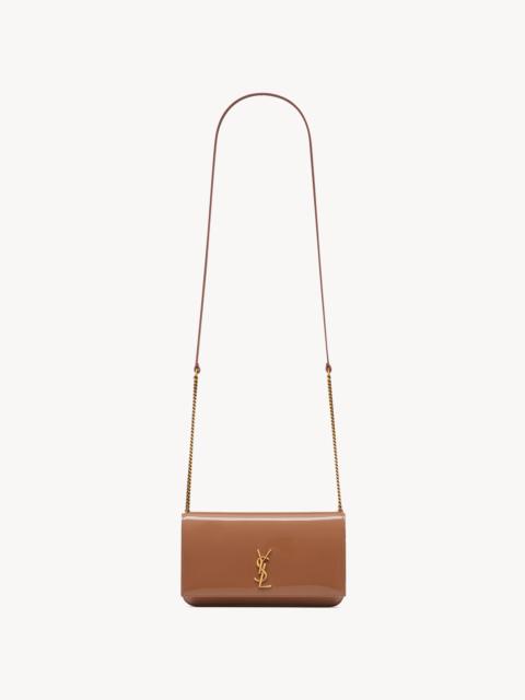 SAINT LAURENT CASSANDRE PHONE HOLDER IN PATENT LEATHER