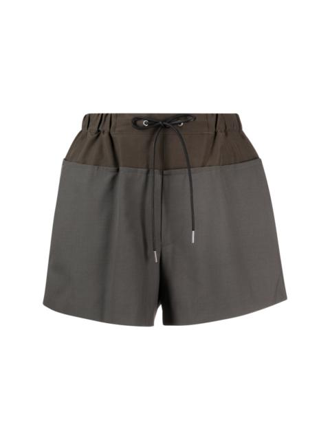 sacai panelled flared shorts