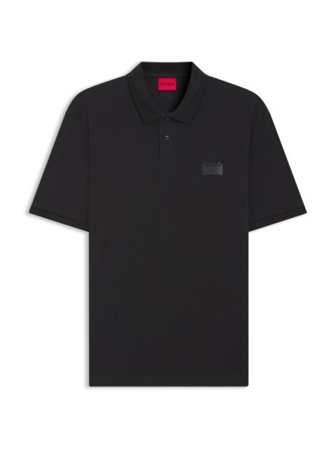 HUGO SPLIT-LOGO RELAXED-FIT POLO SHIRT IN COTTON PIQUÉ