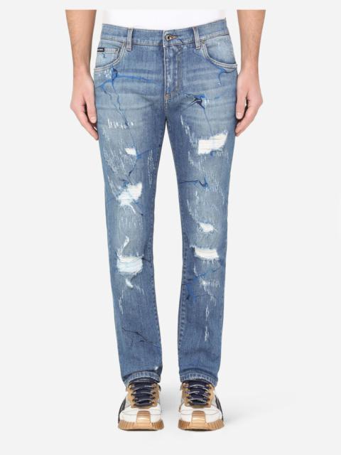Dolce & Gabbana Washed blue skinny stretch jeans with rips and brushstrokes