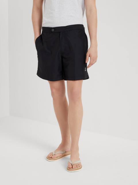 Swim shorts with tabbed waistband and waist tabs