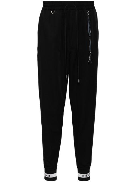 MASTERMIND WORLD logo print track pants