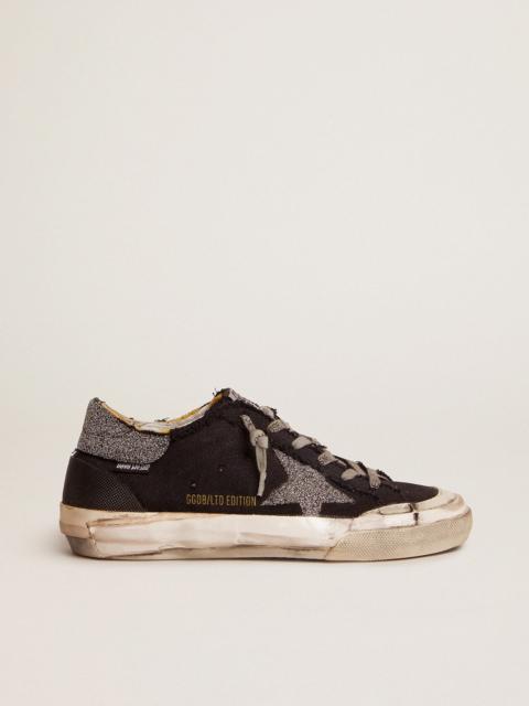 Golden Goose Super-Star Penstar LAB sneakers in black distressed canvas with crystal star and heel tab