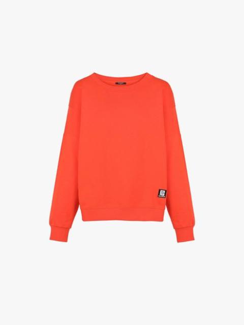 Balmain Dark orange eco-designed cotton sweatshirt with white Balmain logo print