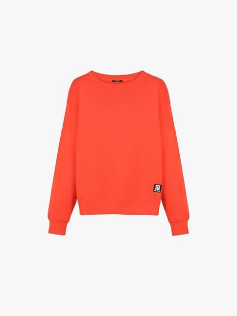 Dark orange eco-designed cotton sweatshirt with white Balmain logo print