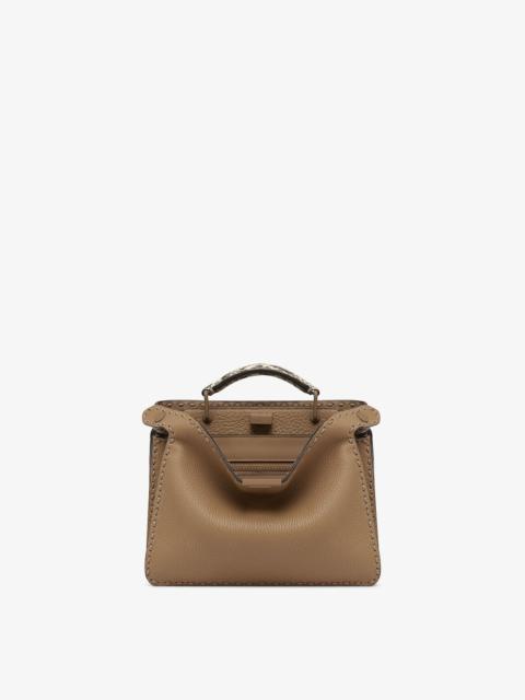 FENDI Small Peekaboo ISeeU bag, made of beige Cuoio Romano leather finished with hand stitching. The inter