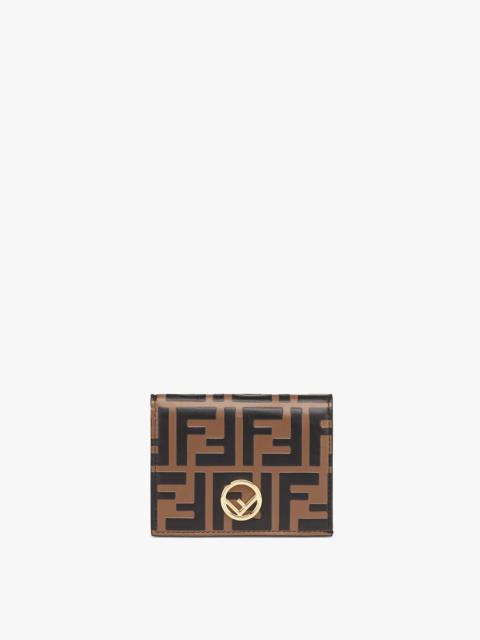 FENDI Small bi-fold F is Fendi wallet. Interior organized with flat pockets, a coin pocket with zip, four 