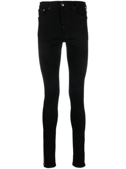 AMIRI M.A. Track skinny jeans