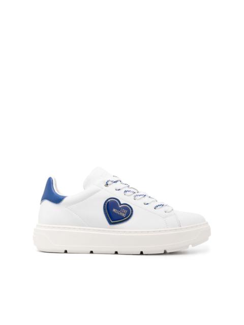 Moschino logo-patch low-top sneakers