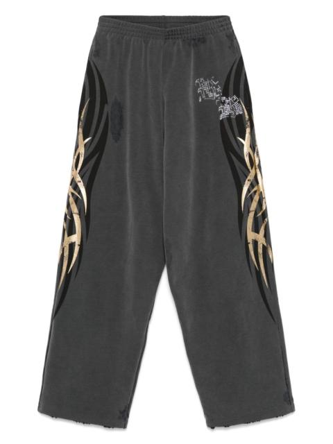 BALENCIAGA tacky gold-print track pants