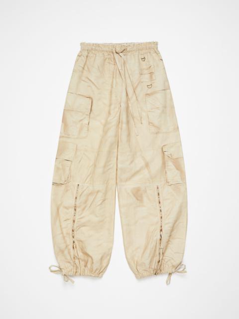 Acne Studios Relaxed fit printed trousers - Oat beige