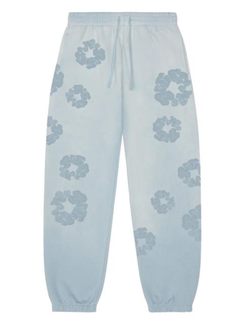 DENIM TEARS flower-embellishment track pant