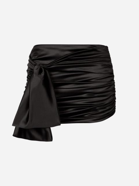 Short draped satin skirt with side bow