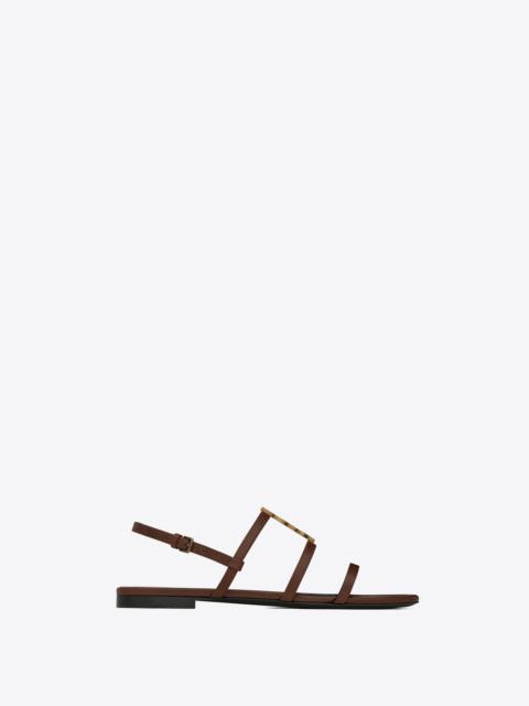 SAINT LAURENT cassandra flat sandals in smooth leather with gold-tone monogram