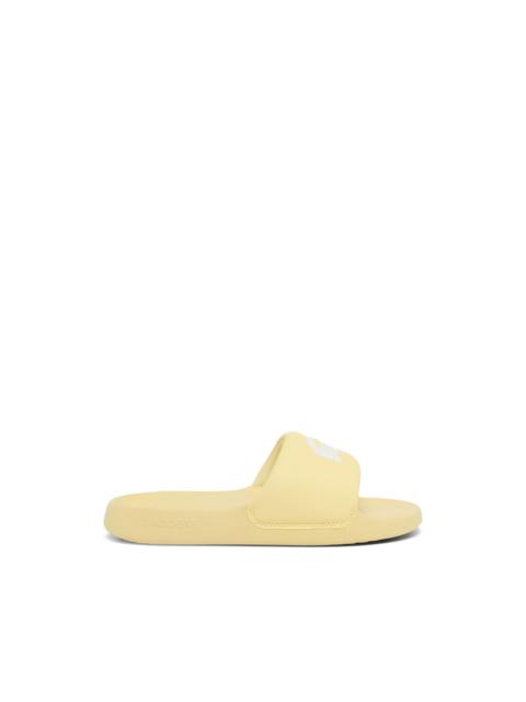 LACOSTE Serve logo slides