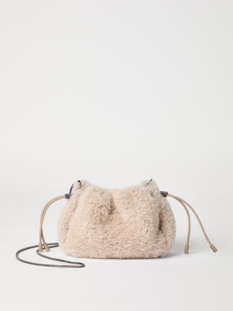 Brunello Cucinelli Mellow mini bucket bag in fuzzy shearling with precious chain