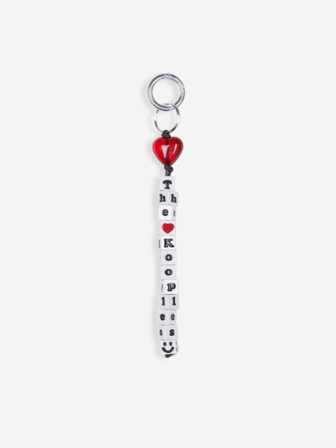 The Kooples WHITE AND RED BEADED BAG CHARM