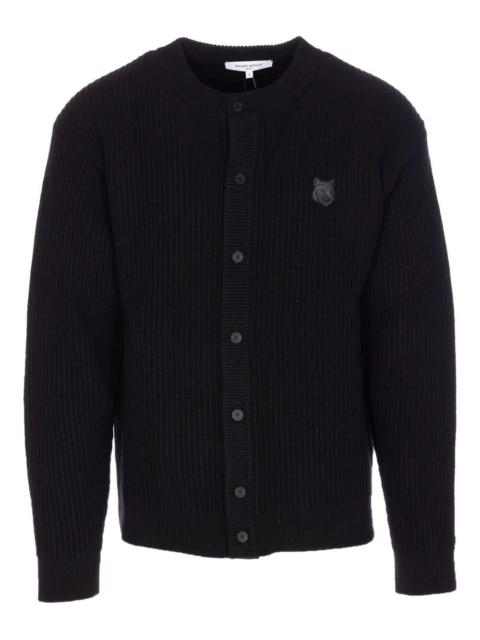 Maison Kitsuné Introducing the "FOX HEAD" WOOL RIBBED CARDIGAN by MAISON KITSUNE, a chic and sophisticated addition