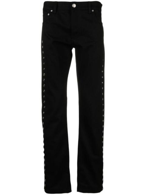 Alexander McQueen metal-eyelet detail jeans