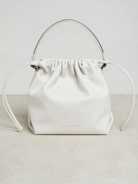 Brunello Cucinelli Matte calfskin bucket bag with shiny handle