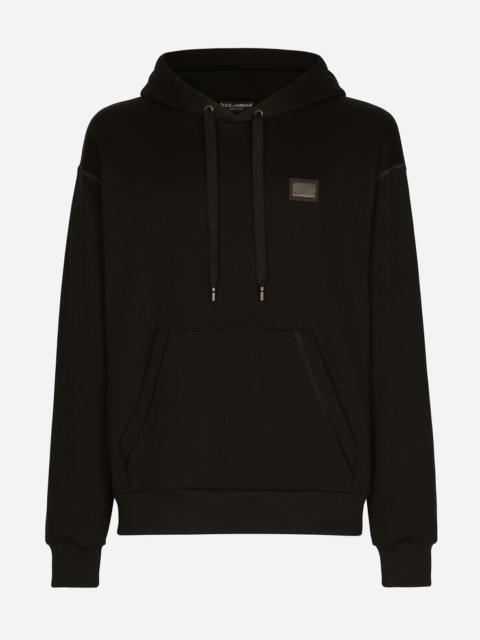 Jersey hoodie with branded tag