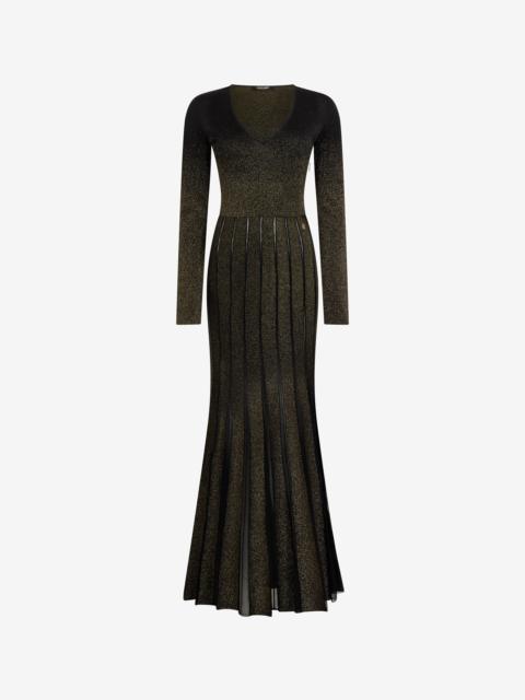 Long dress in black and gold with pleated skirt