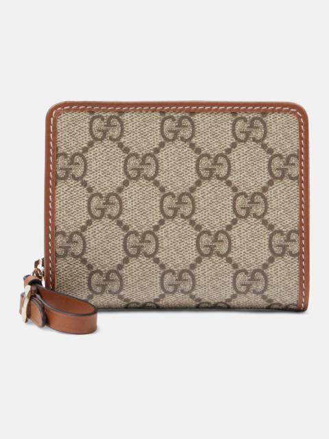 GUCCI GG Canvas Mini leather-trimmed wallet