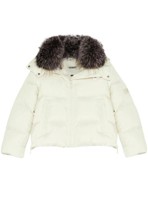 Short A-line puffer jacket made from a water-resistant performance fabric with a fox fur collar
