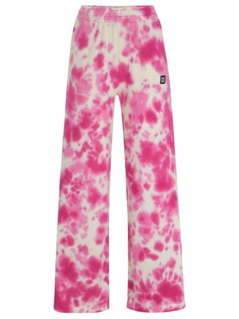 HUGO STRAIGHT-LEG TRACKSUIT BOTTOMS WITH SEASONAL PRINT