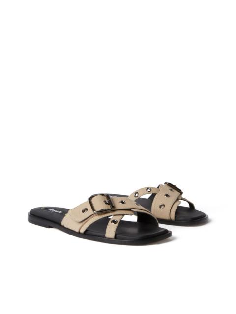 Flat sandal with buckle and eyelets