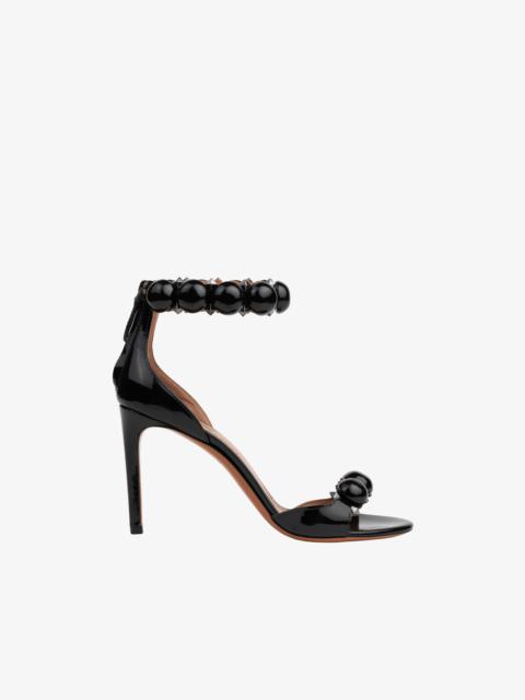 Alaïa BOMBE SANDALS IN PATENT CALFSKIN