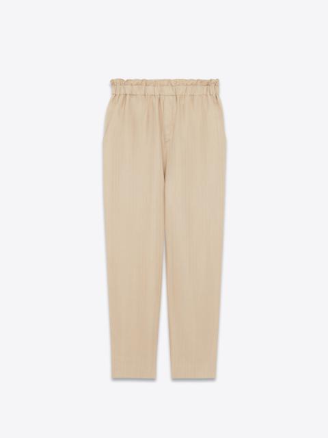 high-waisted pants in  matte and shiny striped silk