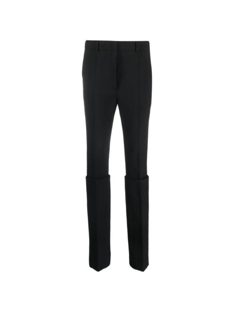 layered tapered-leg trousers