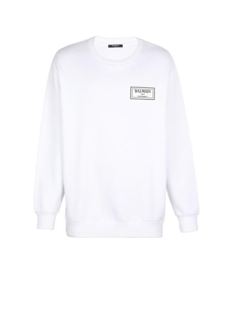 Sweatshirt with rubber patch