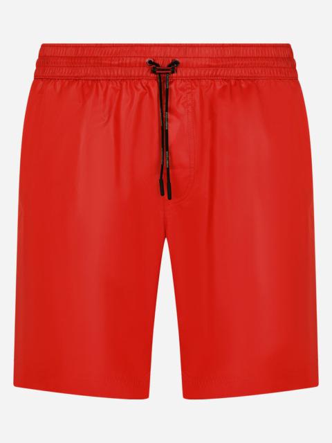 Mid-length swim trunks with side bands