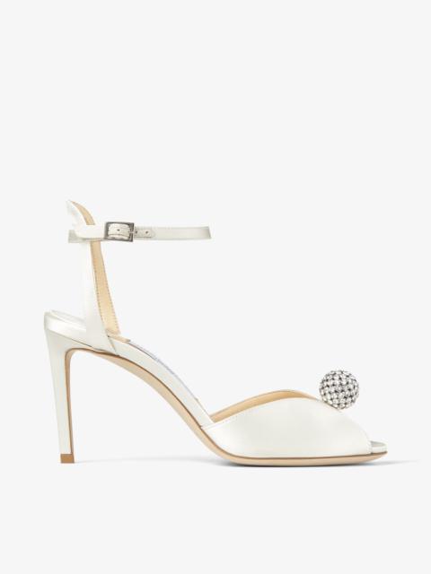 Sacora 85
Ivory Satin Sandals with Crystal-Embellished Sphere