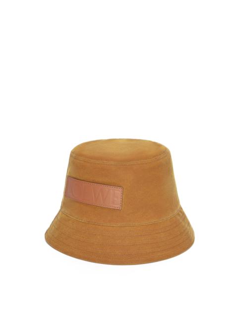Bucket hat in waxed canvas and calfskin
