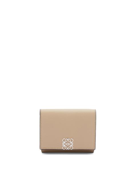 Anagram trifold wallet in pebble grain calfskin