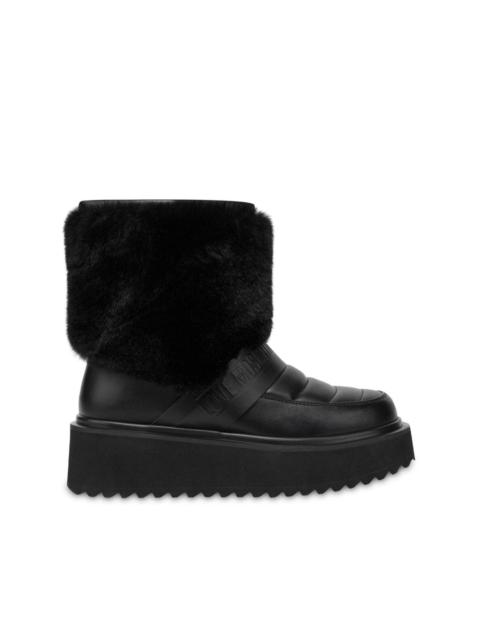 Moschino logo-embossed slip-on boots