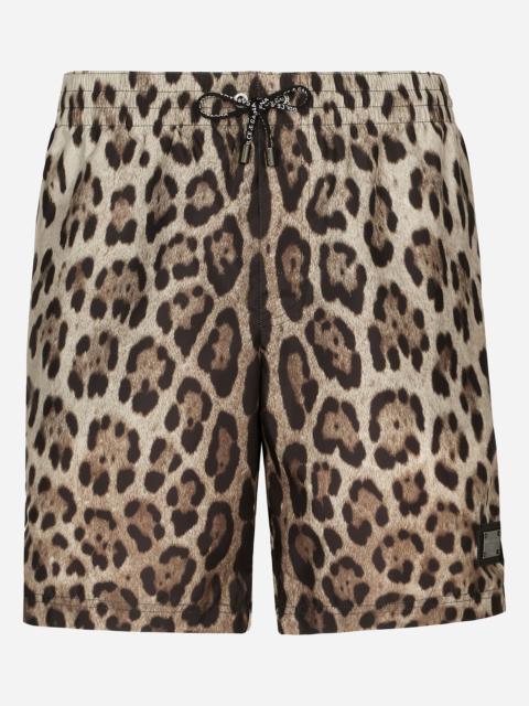 Mid-length swim trunks with leopard print