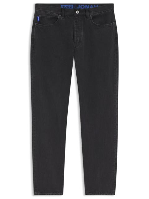 HUGO REGULAR-FIT JEANS IN BLACK DENIM